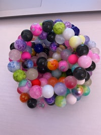 a group of colorful beads arranged on a table