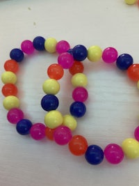 a set of colorful beads on a table